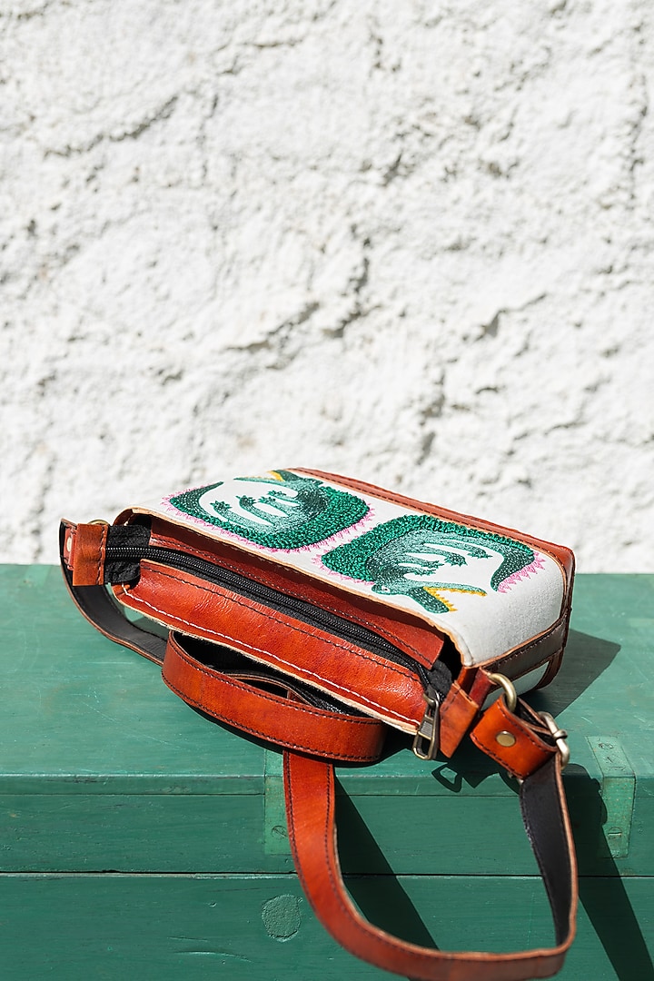 White Hand Embroidered Sling Bag by KrutiArts at Pernia's Pop Up Shop