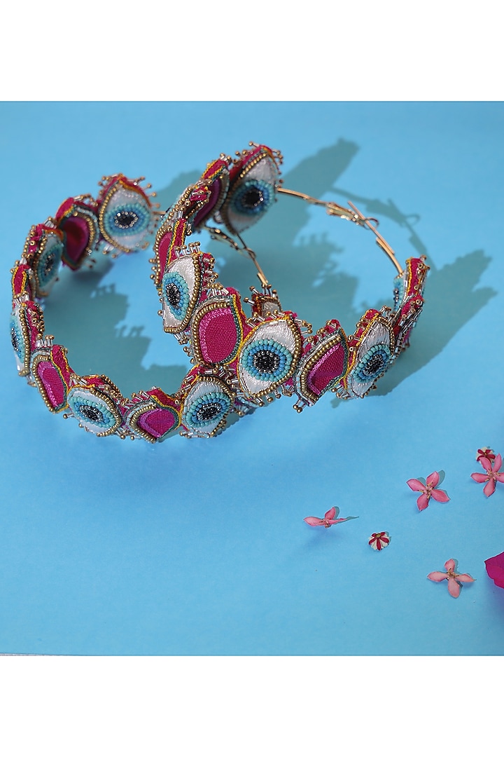 Pink Hand Embroidered Evil Eyes Hoop Earrings by KrutiArts at Pernia's Pop Up Shop