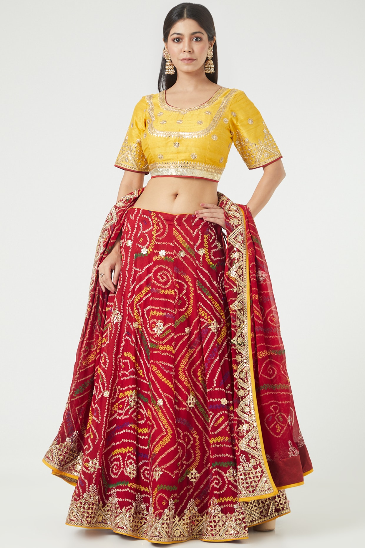 Look youthful in this colorful designer lehenga choli set featuring a red  bandhani lehenga and contrasting yellow … | Red lehenga choli, Red lehenga,  Bandhani dress