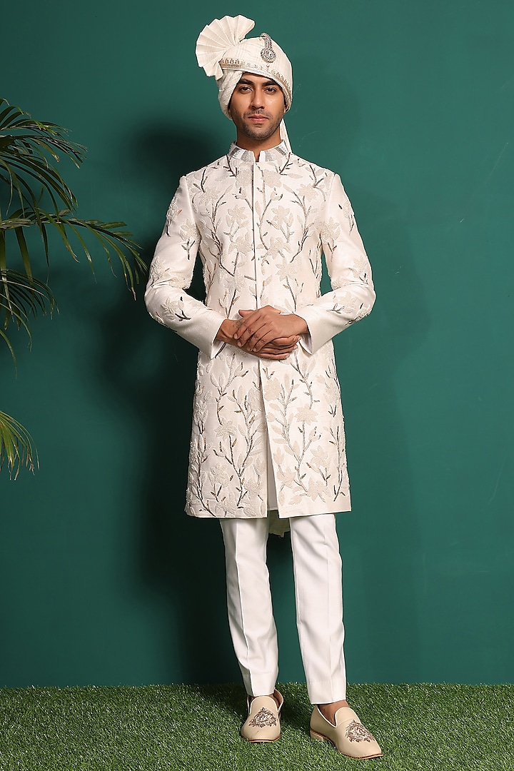 Ivory Raw Silk Embellished Sherwani Set by KUSTOMEYES