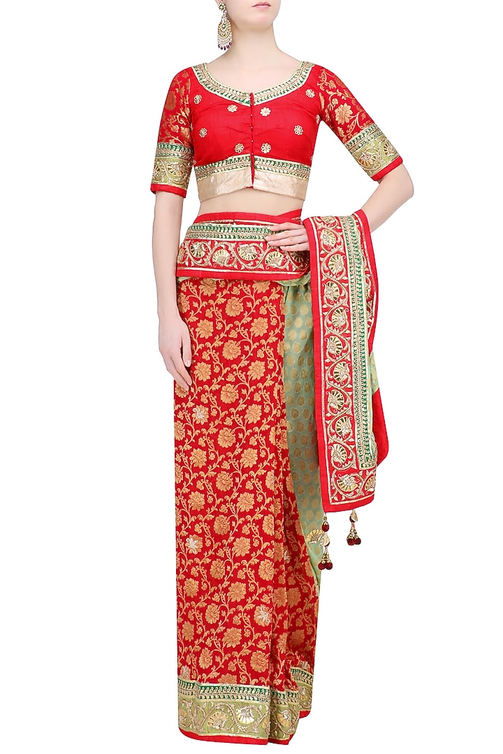 Green and red banarasi half and half saree with red blouse available only at Pernia's Pop Up Shop.