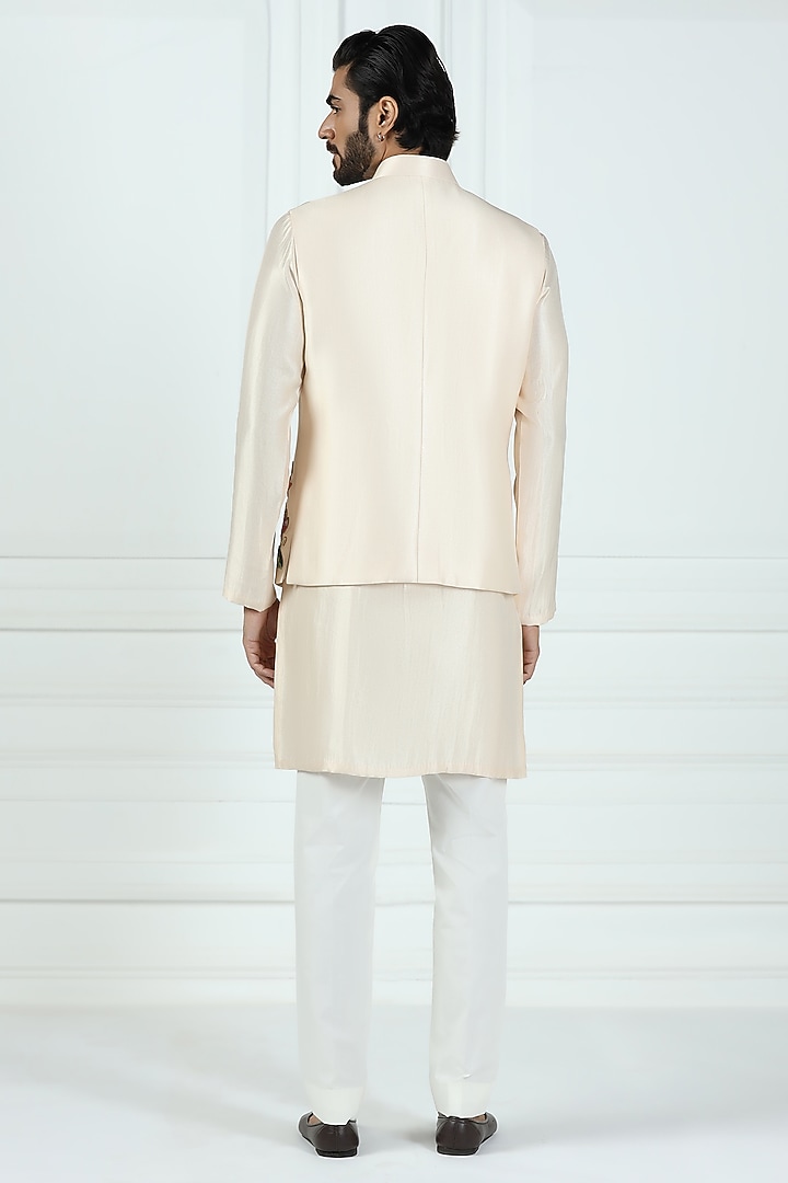 Beige Shimmer Silk Hand Embroidered Asymmetric Nehru Jacket Set by Kushal's Men at Pernia's Pop Up Shop