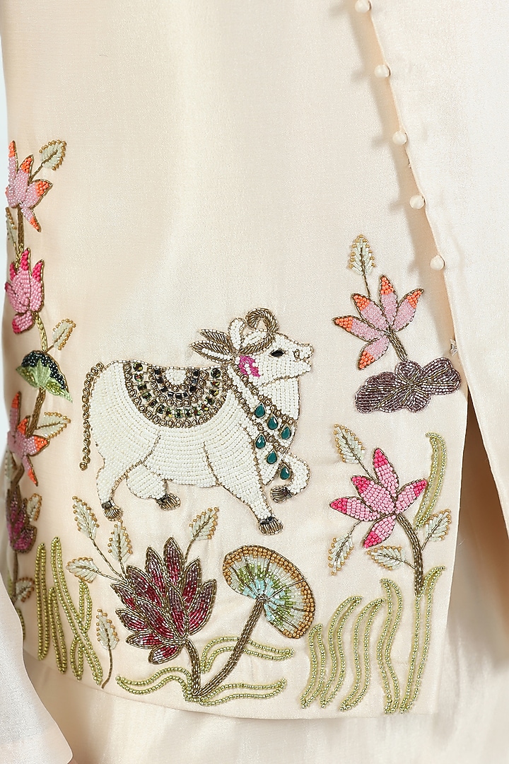 Beige Shimmer Silk Hand Embroidered Asymmetric Nehru Jacket Set by Kushal's Men at Pernia's Pop Up Shop