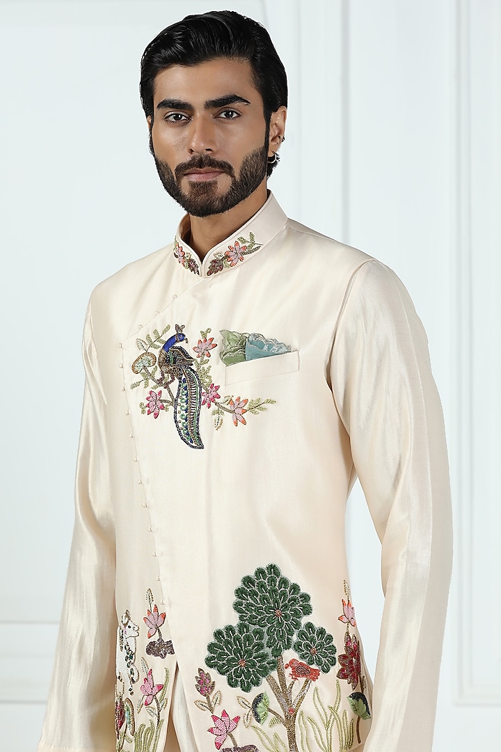 Beige Shimmer Silk Hand Embroidered Asymmetric Nehru Jacket Set by Kushal's Men at Pernia's Pop Up Shop