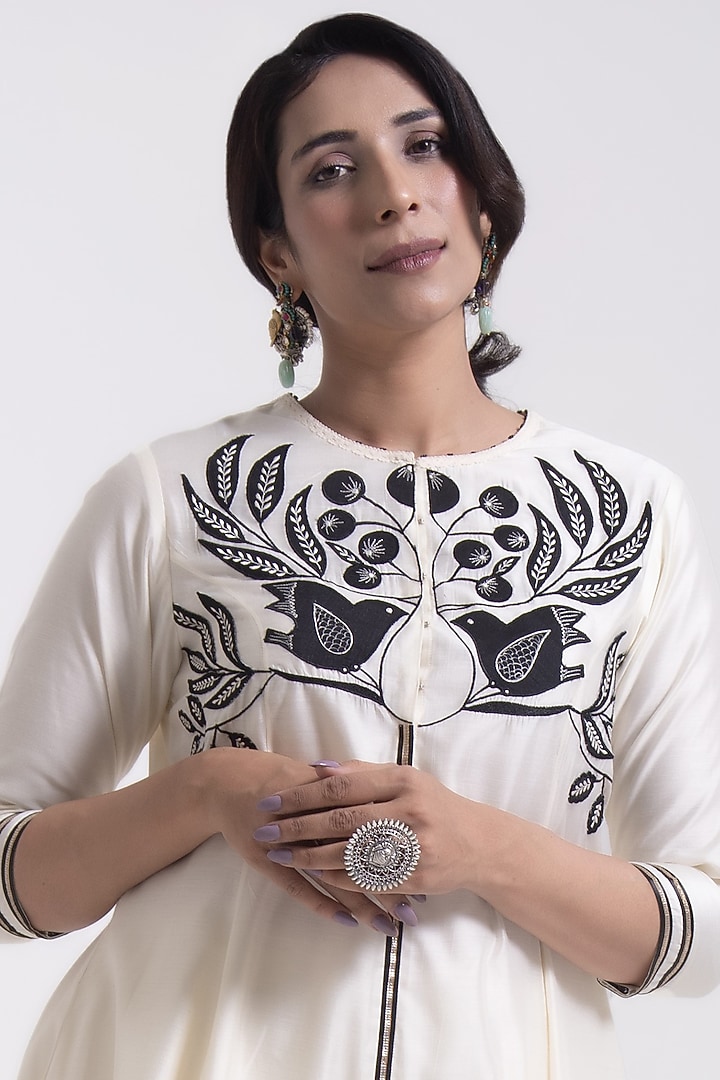 Porcelain White Chanderi Silk Applique Embroidered Asymmetric Kurta Set by Kushani at Pernia's Pop Up Shop