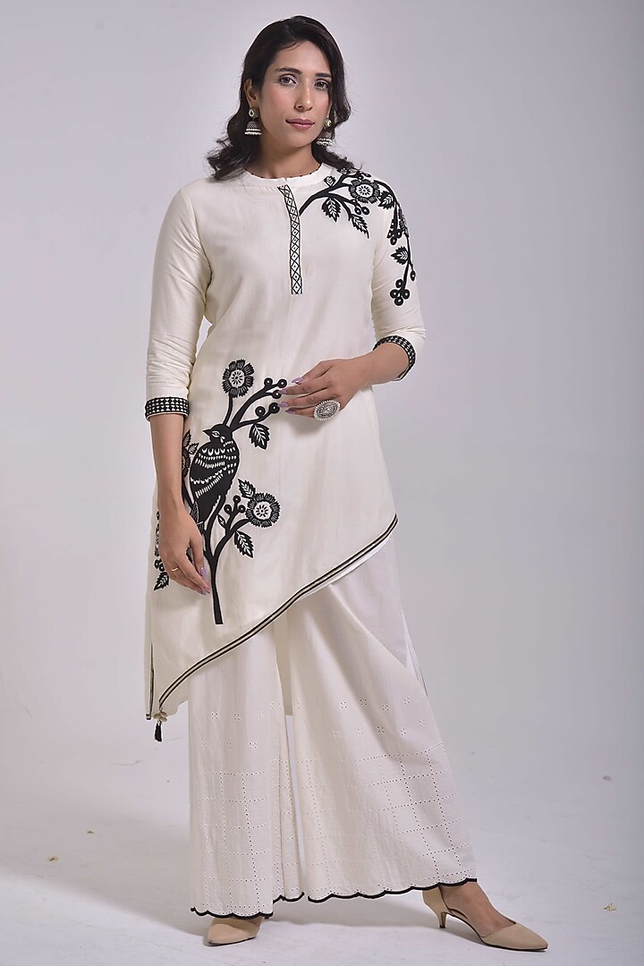 Porcelain White Chanderi Silk Applique Embroidered Asymmetric Kurta Set by Kushani at Pernia's Pop Up Shop