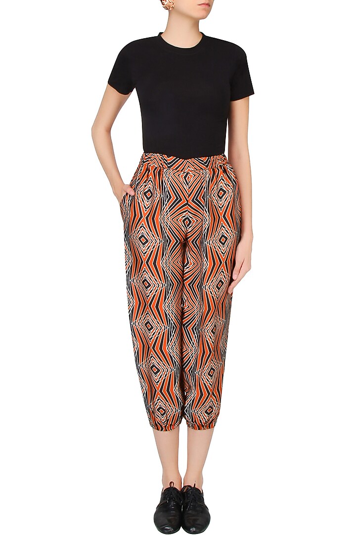 Red and ivory illusionary 3D print jogger pants available only at Pernia's Pop Up Shop.