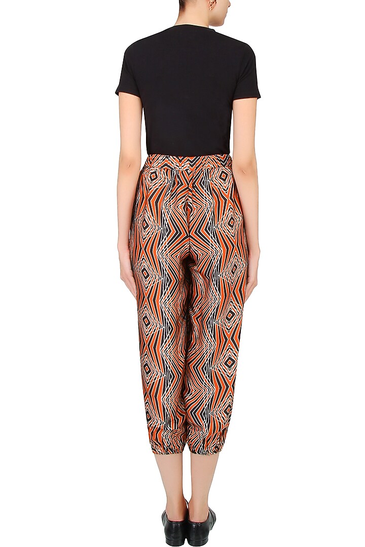 Red and ivory illusionary 3D print jogger pants available only at Pernia's Pop Up Shop.