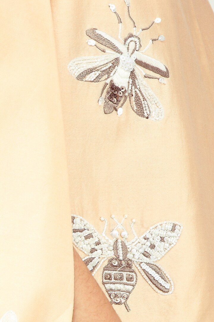 Peach bug motifs embroidered cape jacket available only at Pernia's Pop Up Shop.