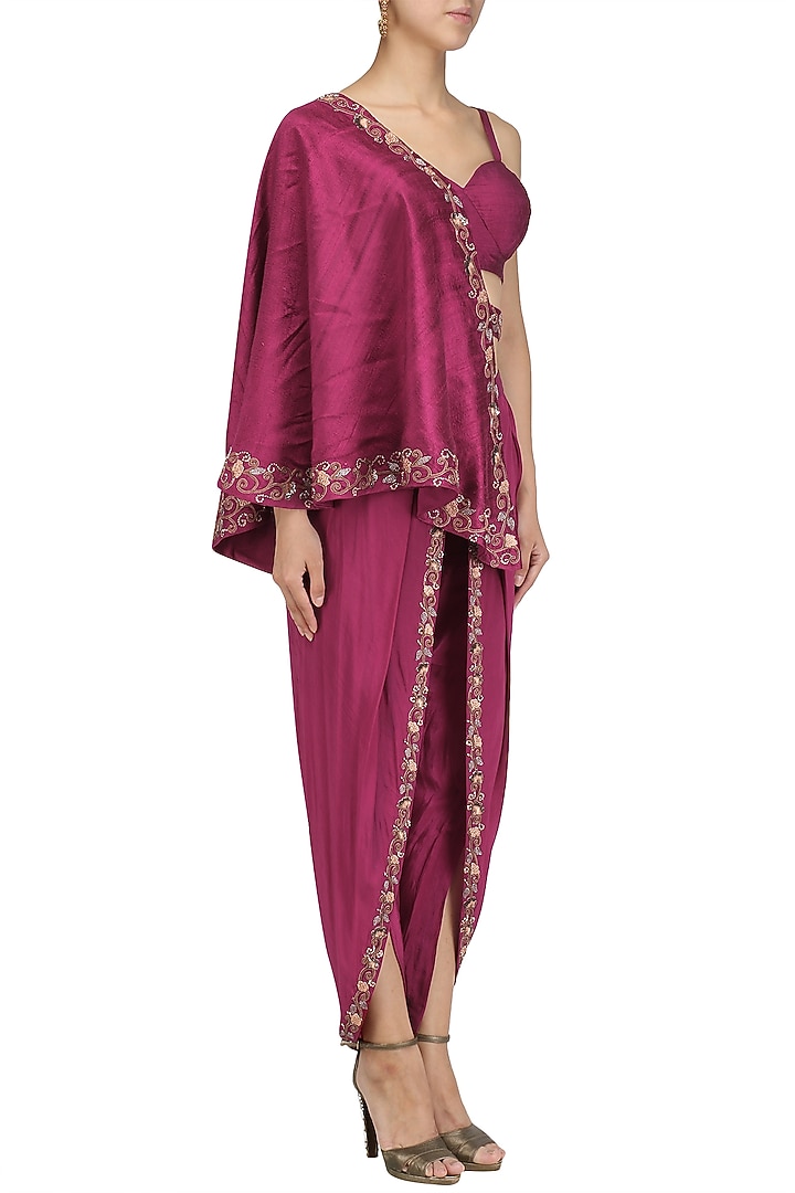 Maroon embroidered dhoti and bustier with one-shoulder cape available only at Pernia's Pop Up Shop.