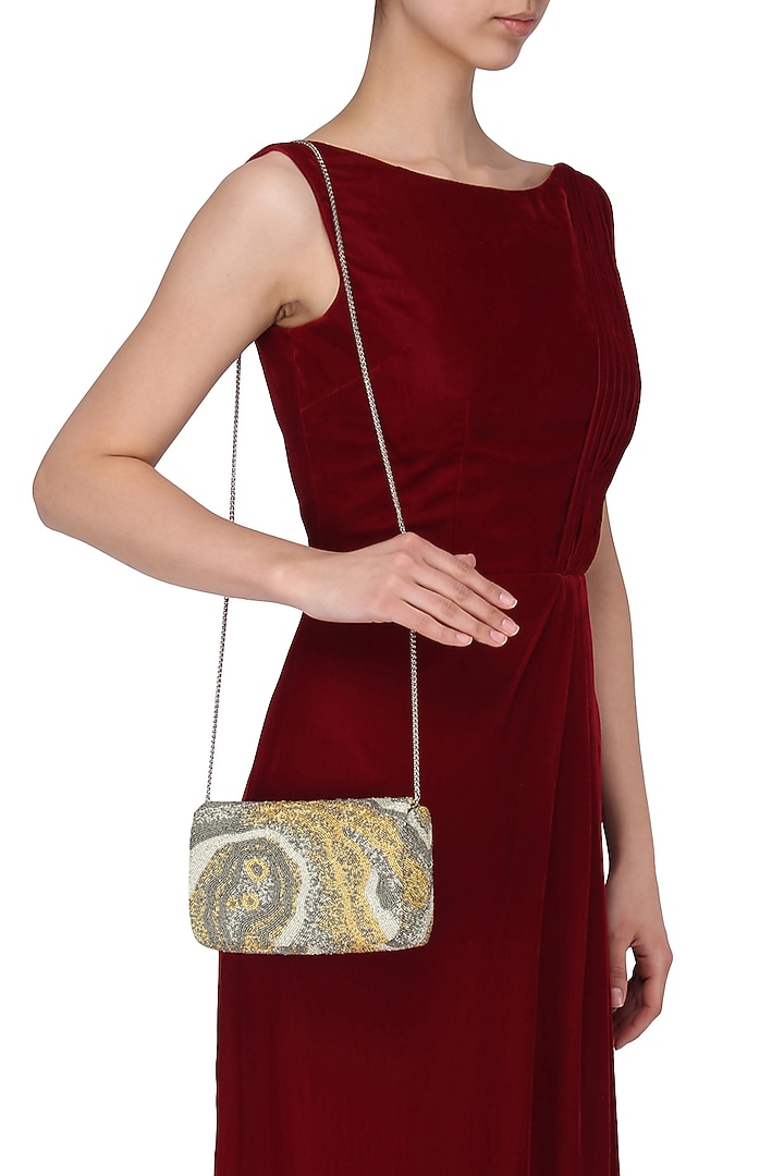Silver, white and gold pschyadelic box clutch available only at Pernia's Pop Up Shop.