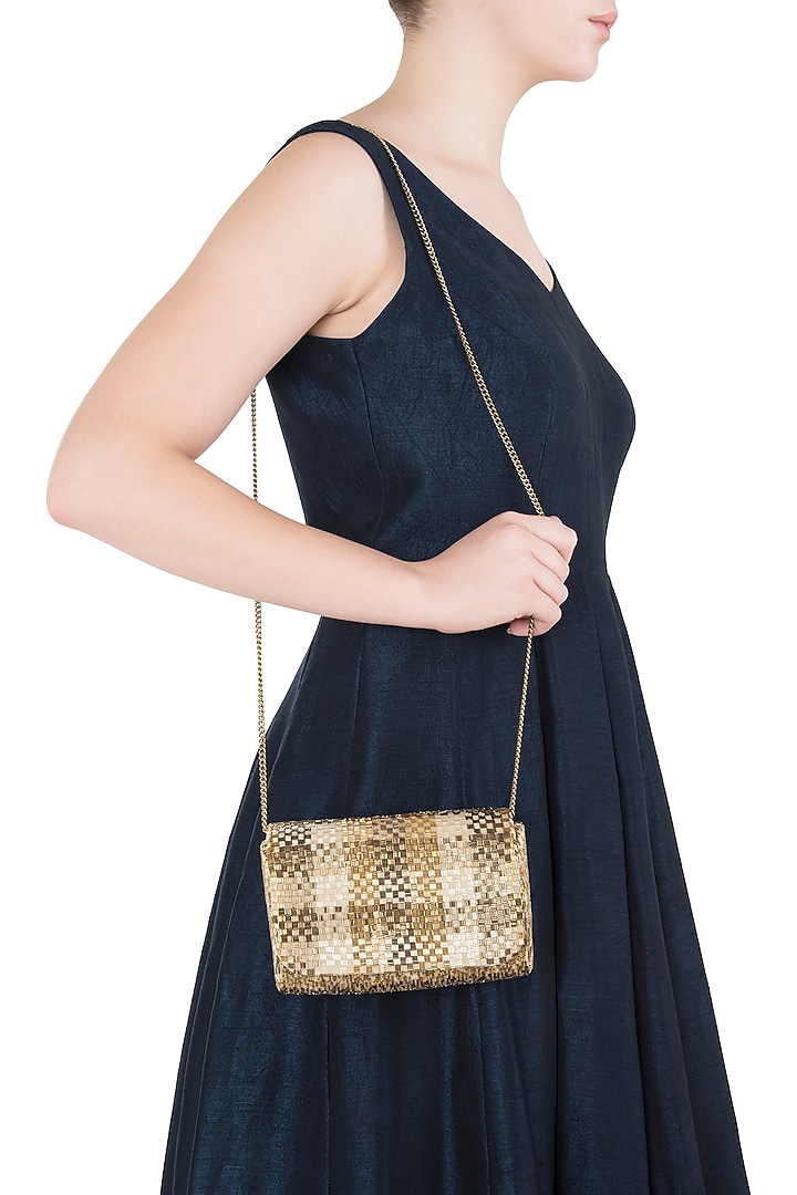 Gold embroidered flapover clutch available only at Pernia's Pop Up Shop.