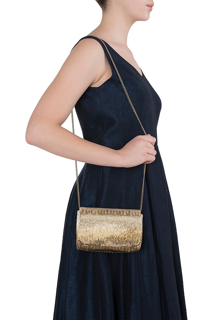 Gold beads embroidered flapover clutch available only at Pernia's Pop Up Shop.
