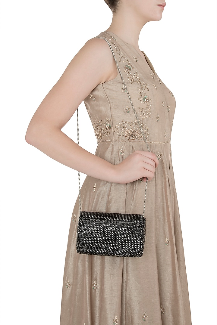 Black embroidered flapover clutch available only at Pernia's Pop Up Shop.