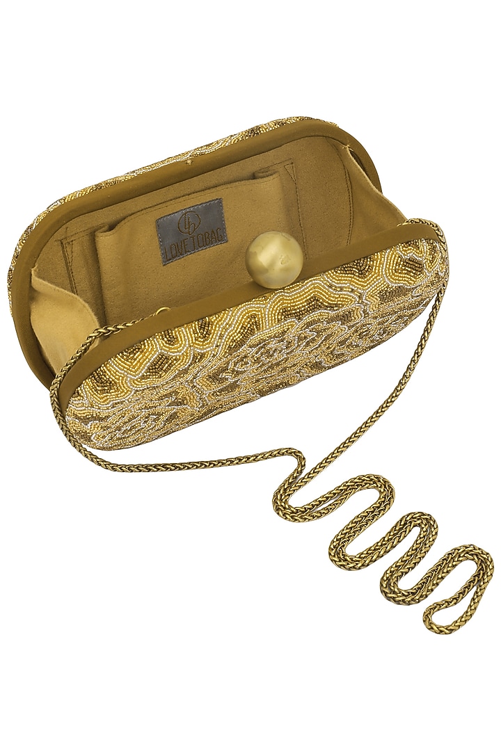 Gold embroidered rosette oval box clutch available only at Pernia's Pop Up Shop.