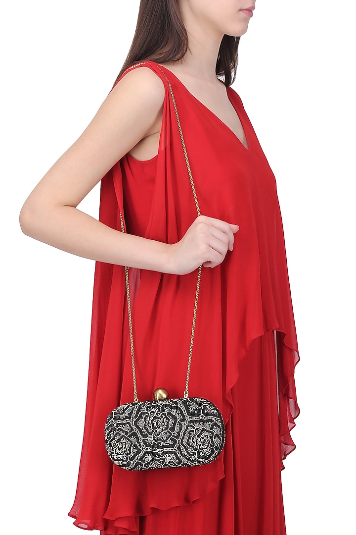 Black embroidered rosette oval box clutch available only at Pernia's Pop Up Shop.