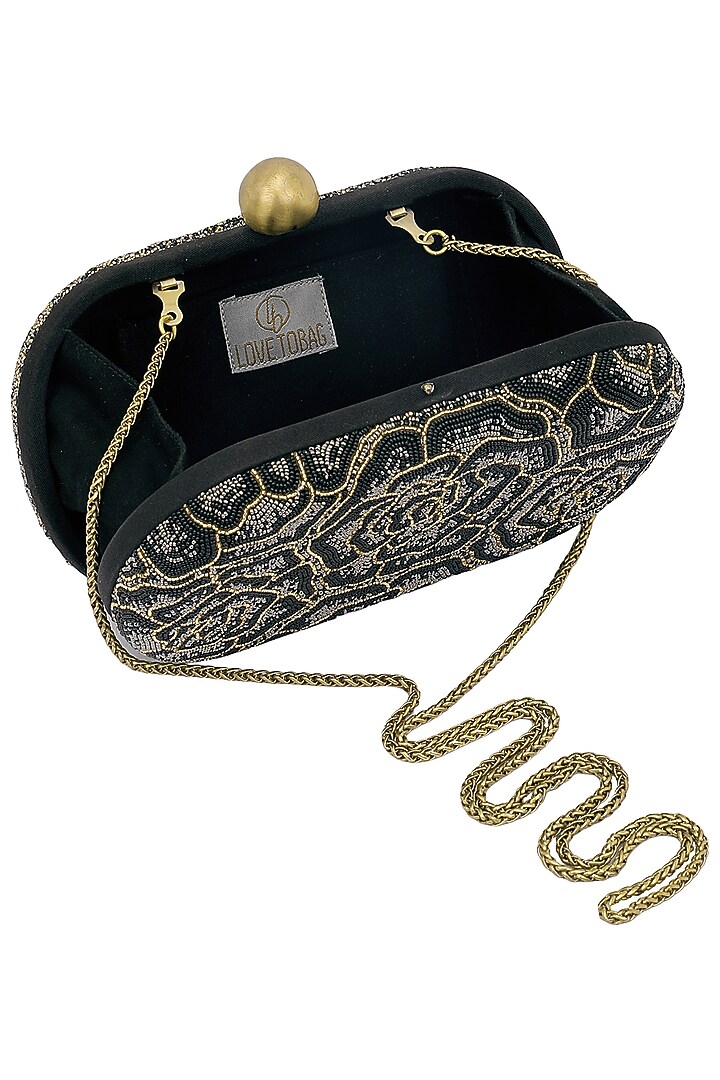 Black embroidered rosette oval box clutch available only at Pernia's Pop Up Shop.