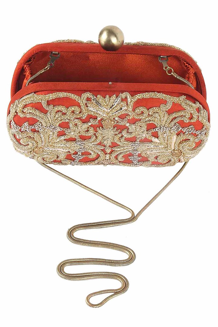 Rust beads and dabka zardosi embroidered oval box clutch available only at Pernia's Pop Up Shop.