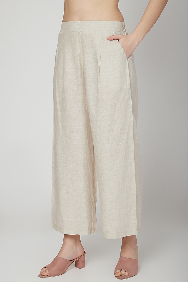 Beige Elasticated Flared Pants by Linen Bloom