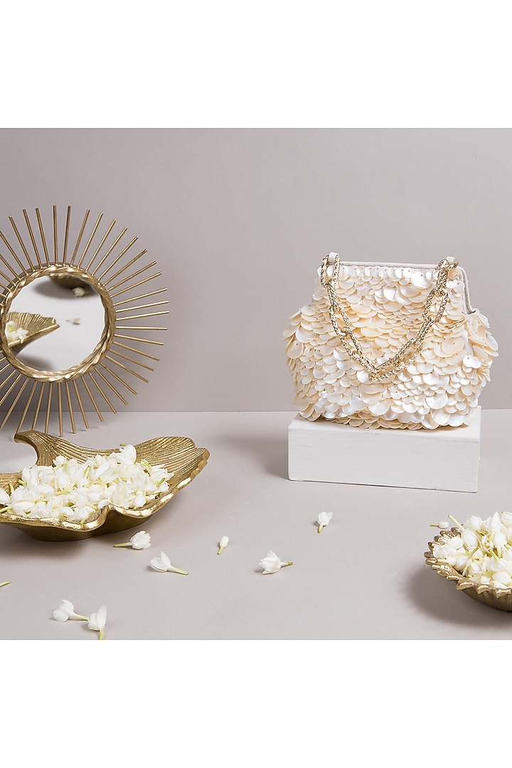Off White Potli Bag With Pearls Detailing by The Leather Garden at Pernia's Pop Up Shop