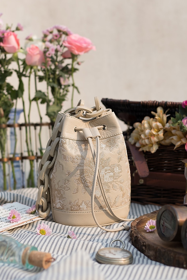 Off White Embroidered Bucket Bag Design by The Leather Garden at Pernia
