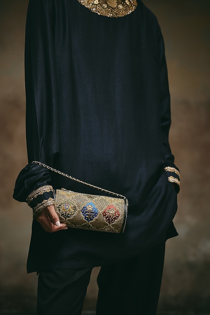 Black Leather Hand Embroidered Cylindrical Clutch by The Leather Garden at Pernia's Pop Up Shop