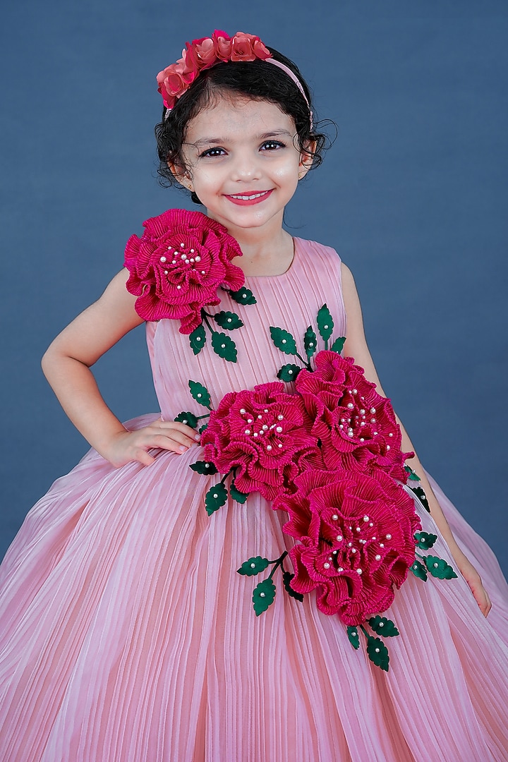 Pastel Pink Pleated Satin & Net Floral Embellished Textured Gown For Girls by Li & Li Boutique at Pernia's Pop Up Shop