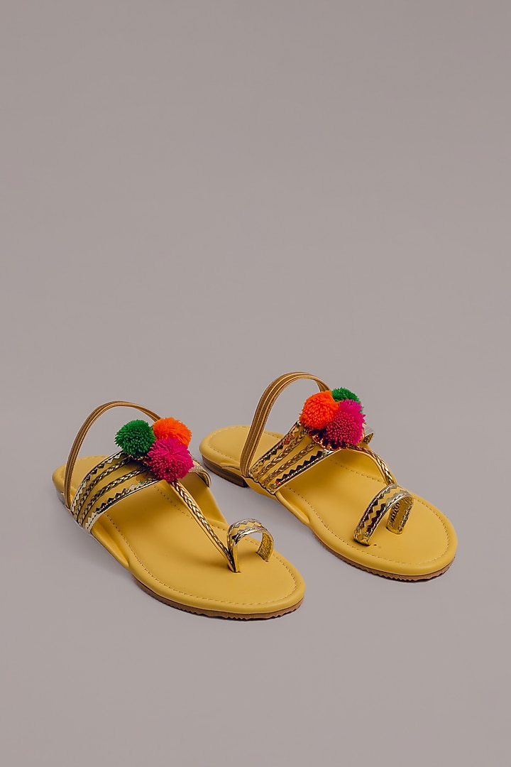 Yellow Synthetic Leather Embellished Kolhapuris For Girls  by LIL PITAARA at Pernia's Pop Up Shop