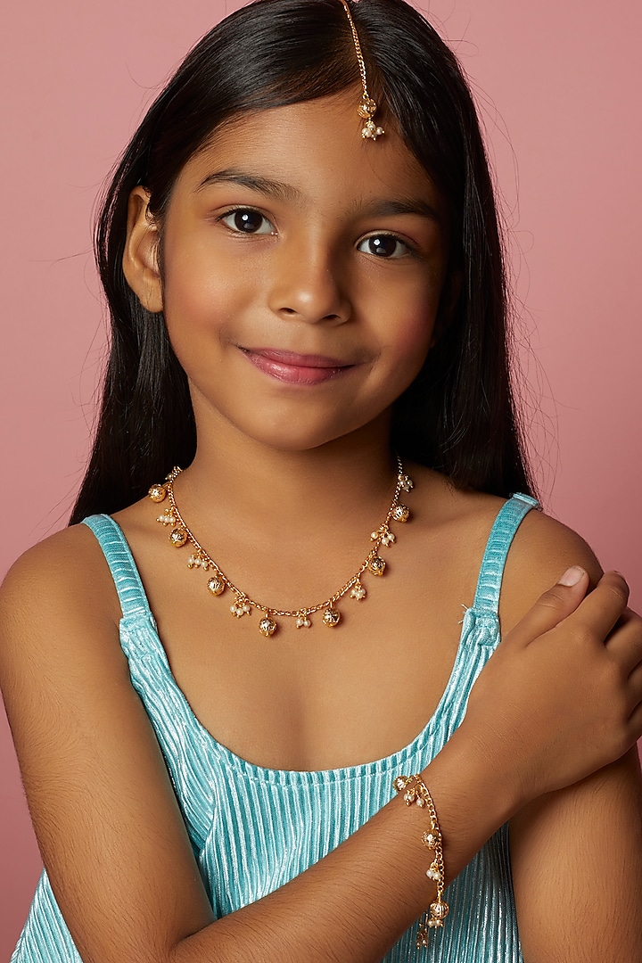 Gold Pearl Maang Tikka With Bracelet For Girls by Lime by Manika