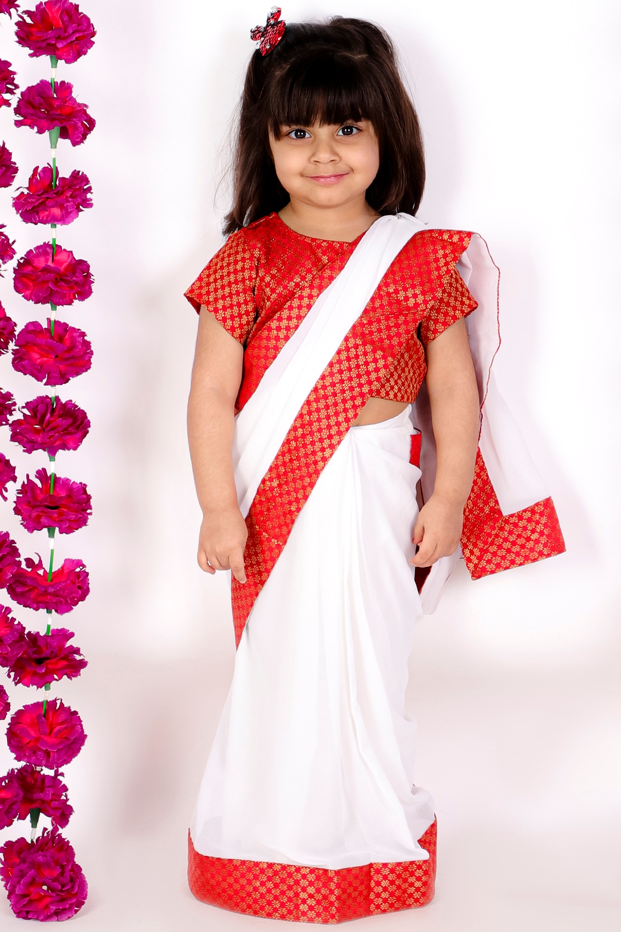 Premium AI Image | Joyful Indian Little Girl in Vibrant Silk Saree  Embodying Cultural Grace with Innocent Smile Radiati...