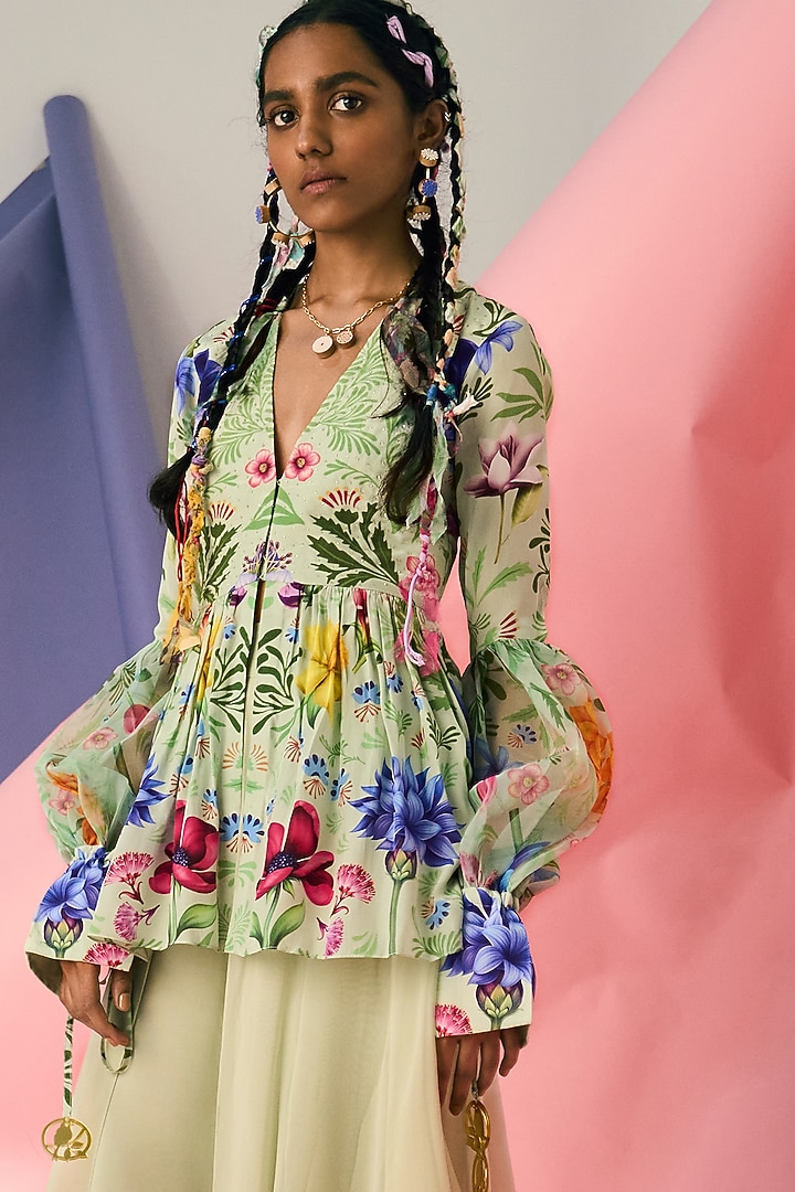 Ivory Embroidered Peplum Top by Limerick By Abirr N' Nanki at Pernia's Pop Up Shop