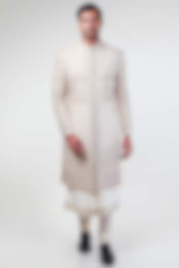 Off-White Raw Silk Hand & Machine Embroidered Sherwani Set by Kommal Sood