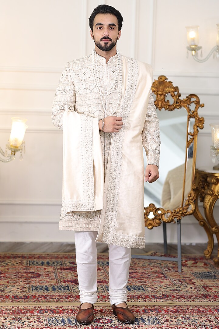 Ivory Pure Silk Dabka Embroidered Sherwani Set by Label Mukund Taneja