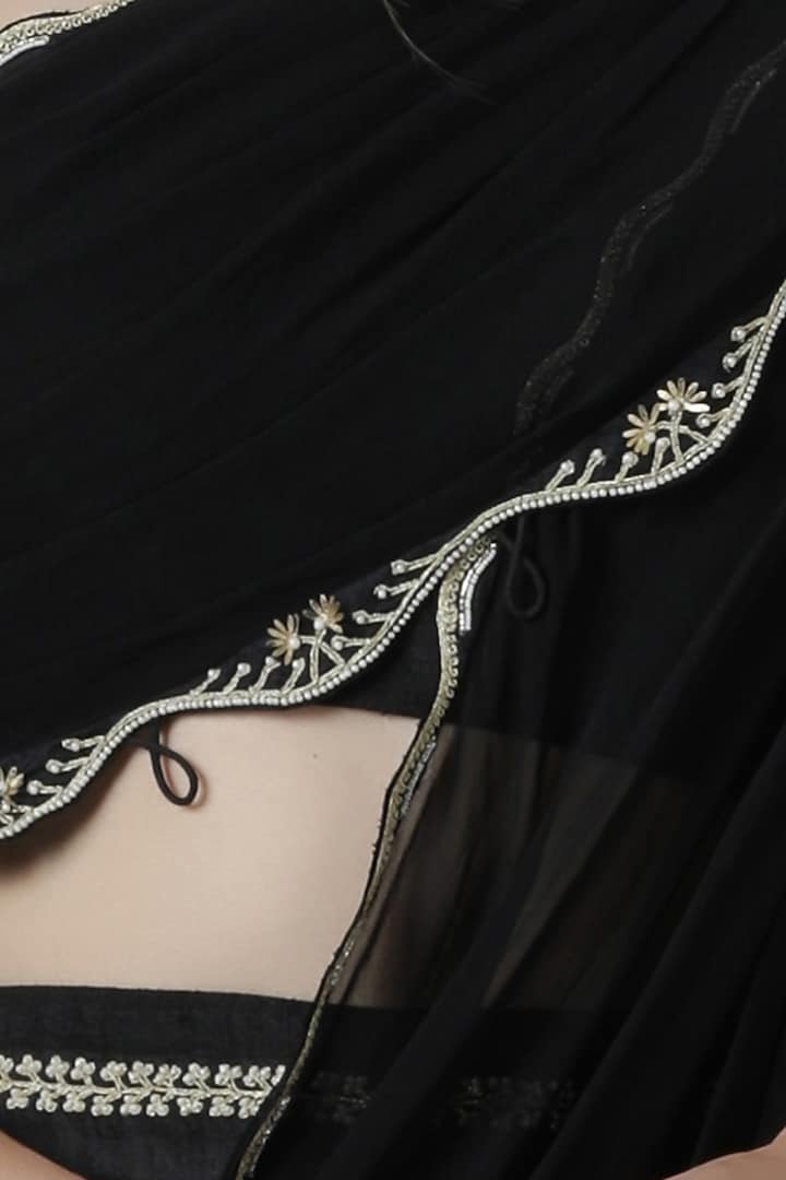 Black embroidered drape top with pleated pants by Limerick By Abirr N' Nanki at Pernia's Pop Up Shop