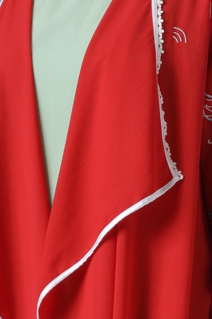 Green asymmetrical tunic with red embroidered jacket by Limerick By Abirr N' Nanki at Pernia's Pop Up Shop