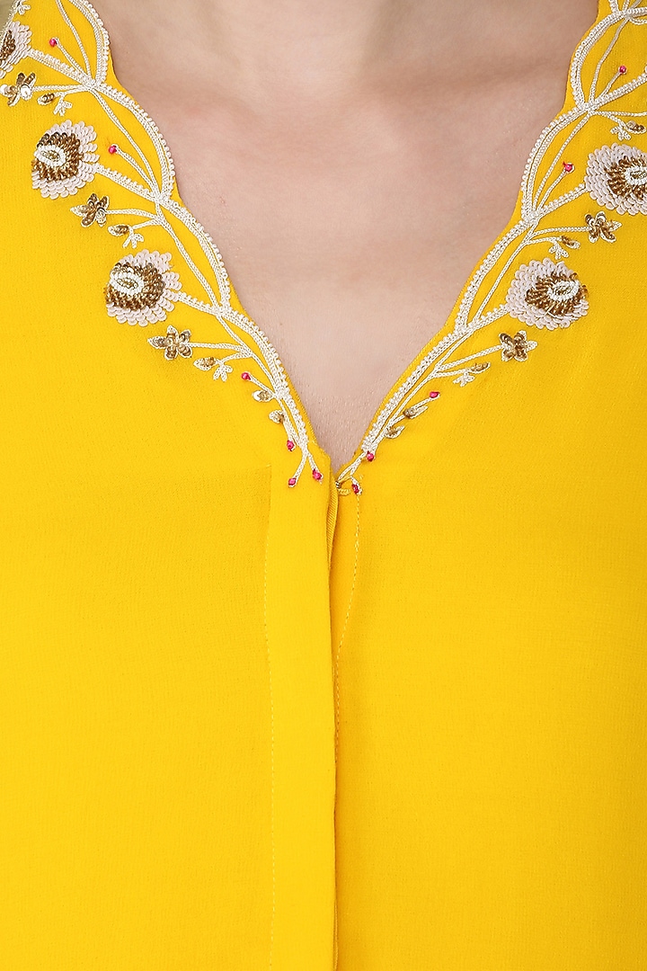 Yellow embroidered kurta with attached cape and sharara pants set available only at Pernia's Pop Up Shop.