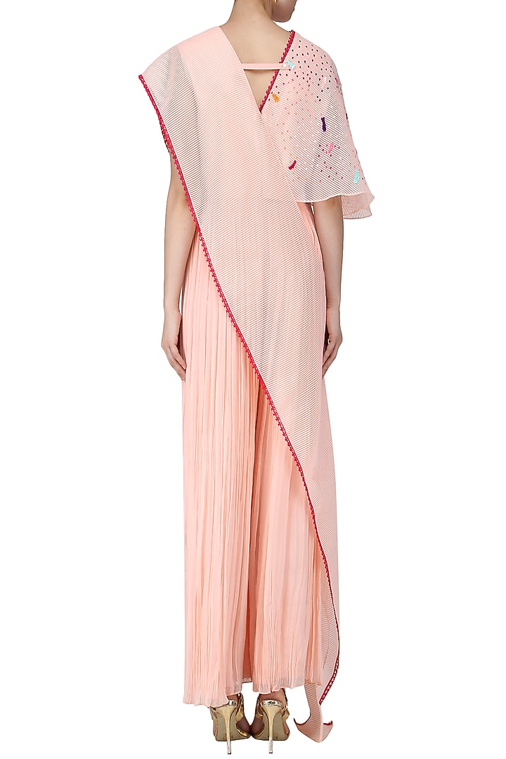Blush pink embroidered jumpsuit with attached drape available only at Pernia's Pop Up Shop.