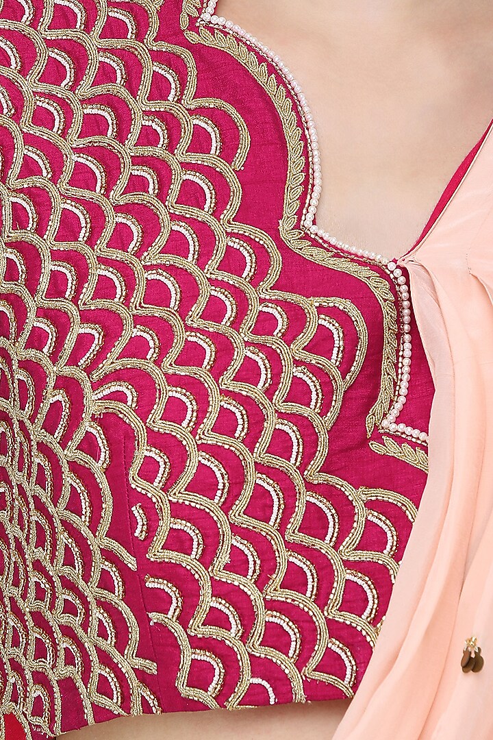 Fuschia pink embroidered blouse with attached drape and gharara pants set available only at Pernia's Pop Up Shop.