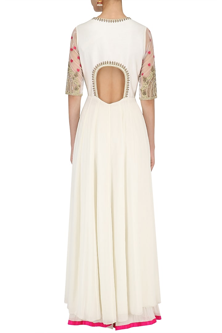 Ivory peacock motif embroidered asymmetrical kurta and sharara set available only at Pernia's Pop Up Shop.