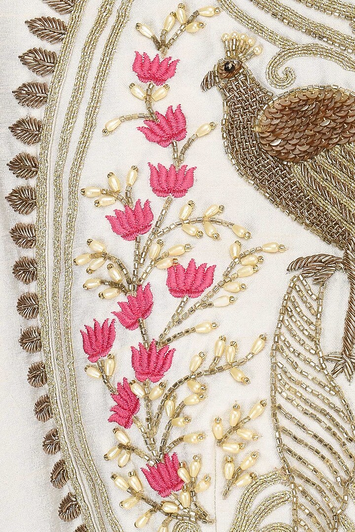 Ivory peacock motif embroidered asymmetrical kurta and sharara set available only at Pernia's Pop Up Shop.