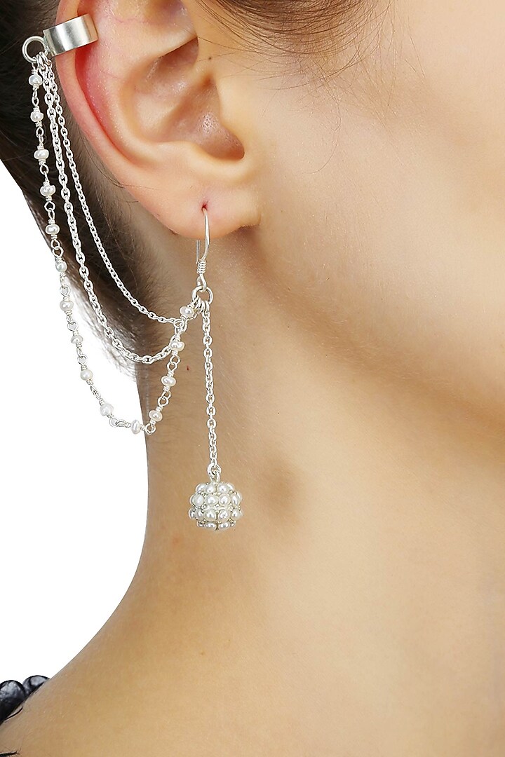 Silver finish seed pearl earrings with attached chain earcuffsavailable only at Pernia's Pop Up Shop.