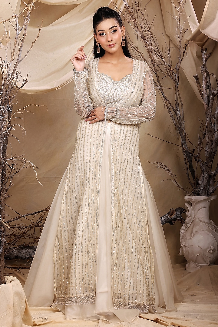 Ivory Organza Sequins Hand Embroidered Jacket Lehenga Set by LASHA