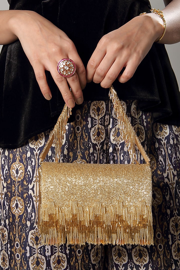 Gold Embroidered Flapover Clutch by Lovetobag at Pernia's Pop Up Shop