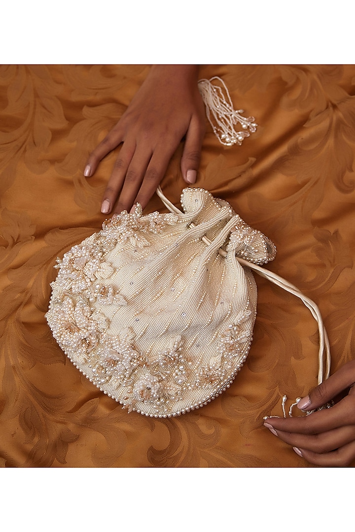 Pristine Ivory Embellished Potli by Lovetobag at Pernia's Pop Up Shop