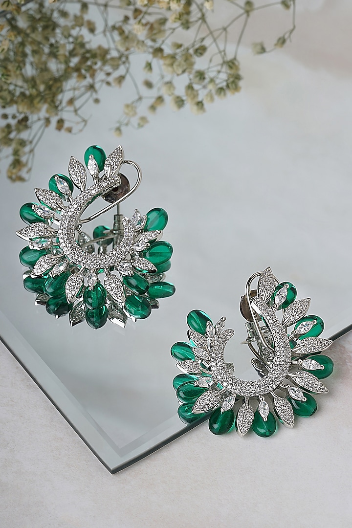White Finish Faux Diamond & Green Stone Hoop Earrings by Mae Jewellery by Neelu Kedia