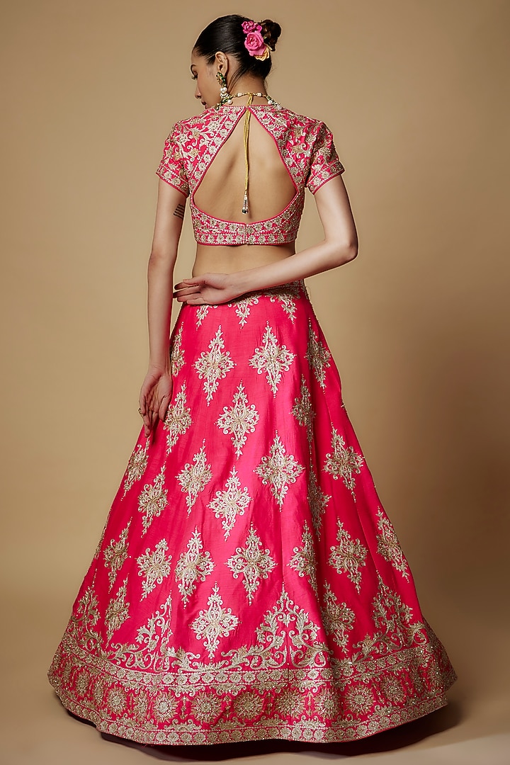 Fuchsia Pink Raw Silk & Net Aari Embroidered Wedding Lehenga Set by Maisolos at Pernia's Pop Up Shop