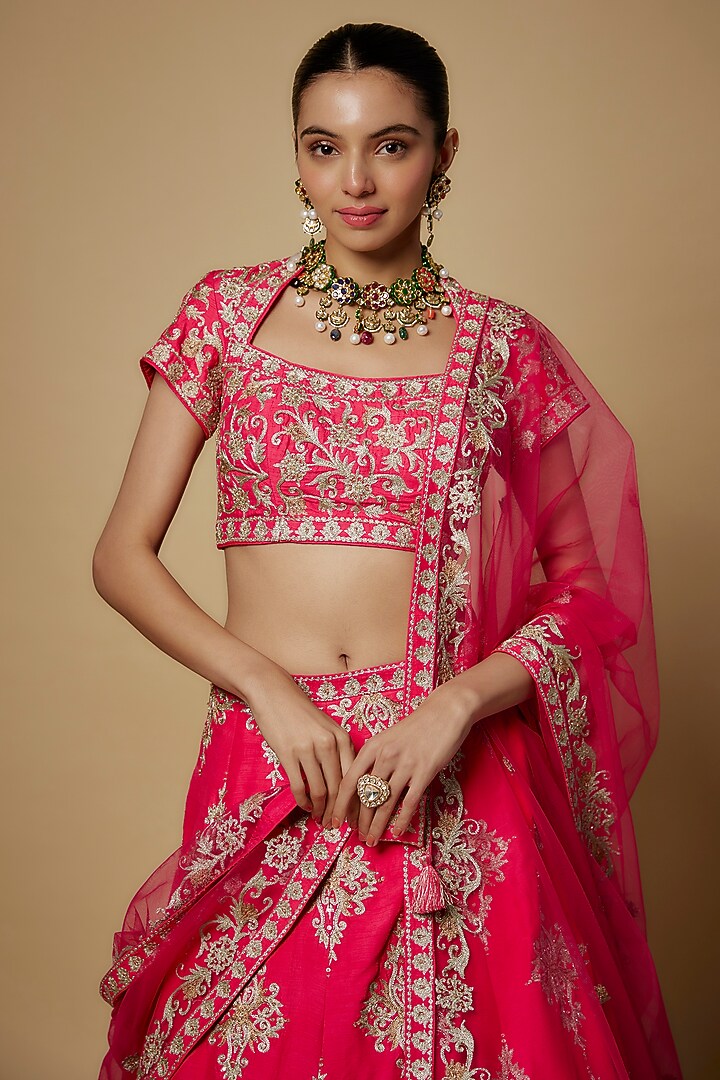 Fuchsia Pink Raw Silk & Net Aari Embroidered Wedding Lehenga Set by Maisolos at Pernia's Pop Up Shop