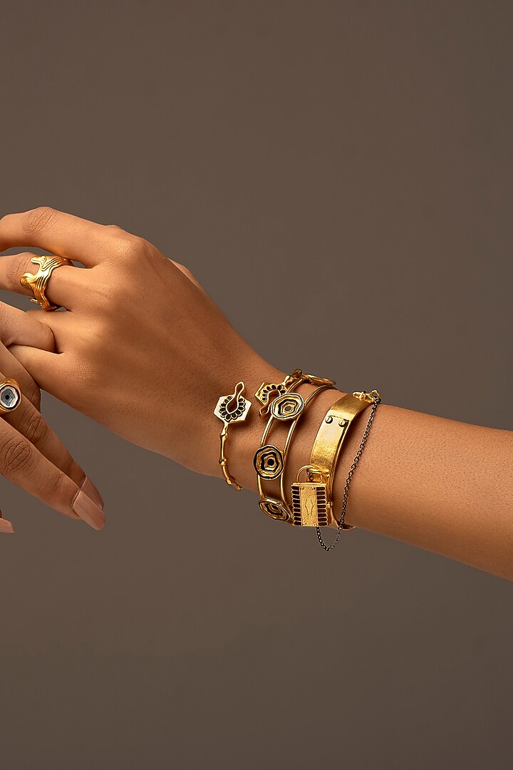 Gold Finish Enameled Cuffs (Set of 2) by Madiha Jaipur at Pernia's Pop Up Shop