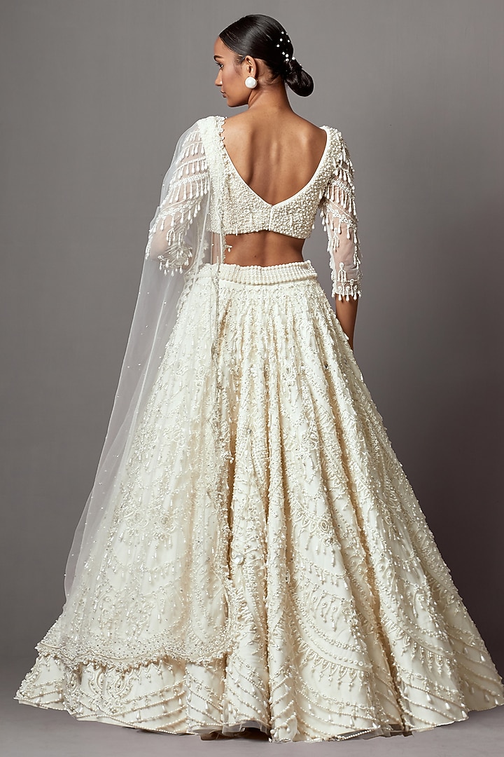 Ivory Net Pearl Embroidered Bridal Lehenga Set by Mala and Kinnary at Pernia's Pop Up Shop