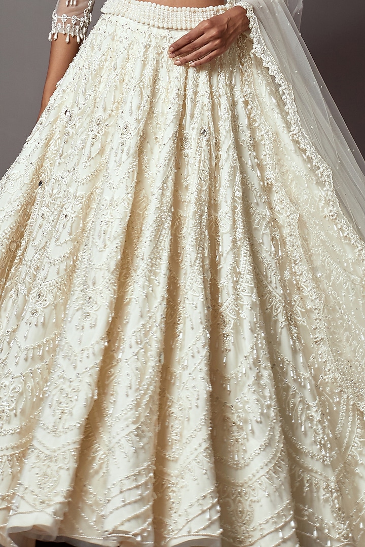 Ivory Net Pearl Embroidered Bridal Lehenga Set by Mala and Kinnary at Pernia's Pop Up Shop